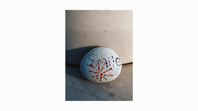 A smooth pebble resting on the ground