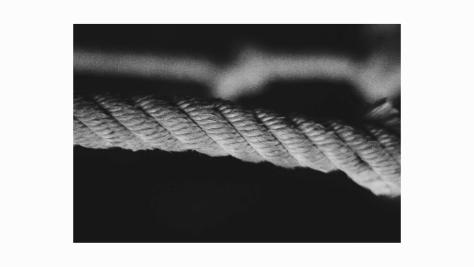A looping piece of string forming a gentle curve