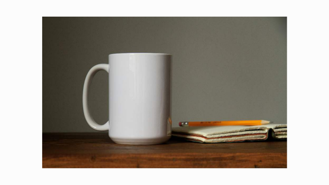 A simple mug with a curved handle