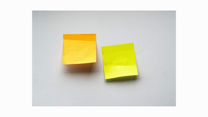 A sticky note with one curled corner