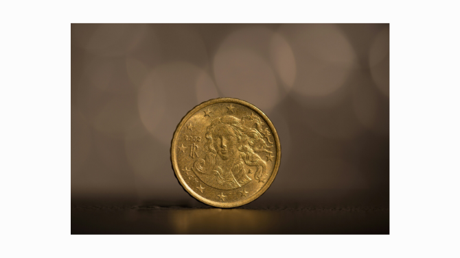 A single coin with a simple rim and centre detail