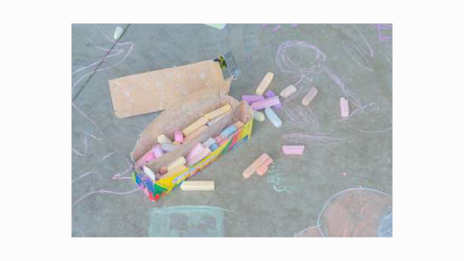 A short stick of chalk beside a chalk mark
